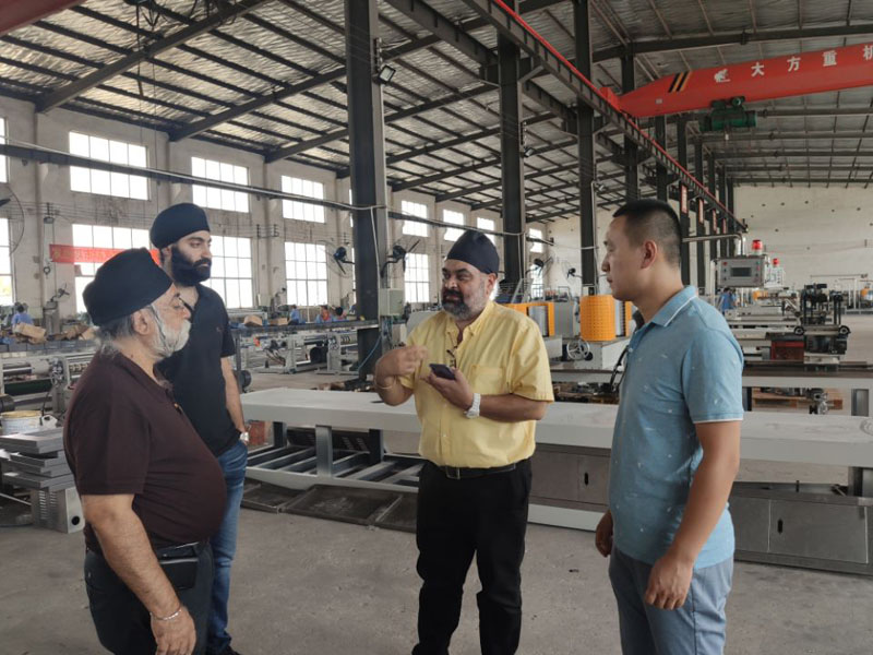 Indian clients come to our factory to visit the paper pipe machine.