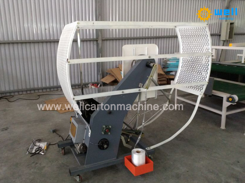Corrugated carton tying machine