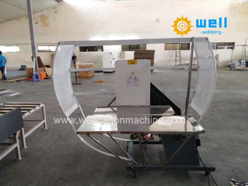 Corrugated carton tying machine