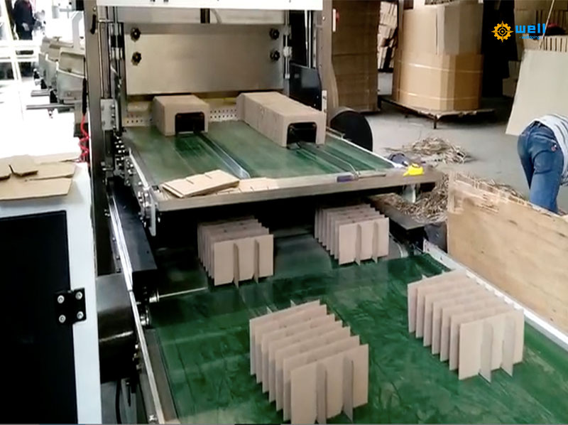 Automatic cardboard carton partition assembly machine