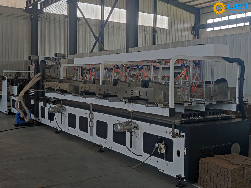 Automatic cardboard carton partition assembly machine