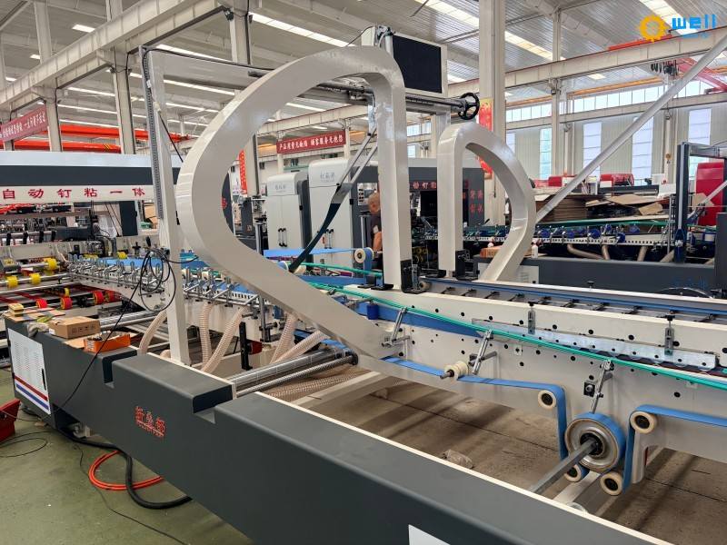 WD-How much does an automatic carton box folder gluer stitching machine cost WD-How much does an automatic carton box folder gluer stitching machine cost